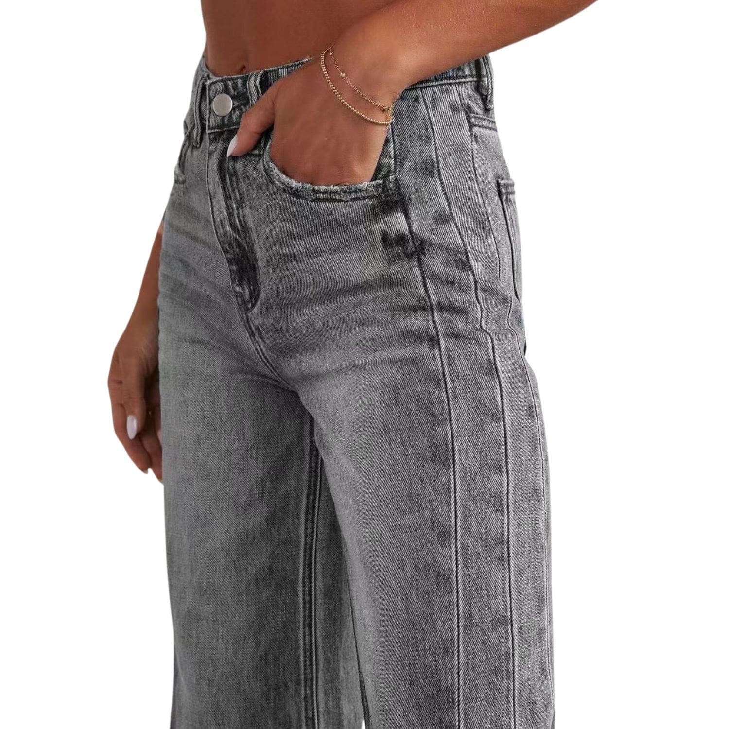 Close-up of women’s high-waisted gray wide-leg denim jeans with raw hem.