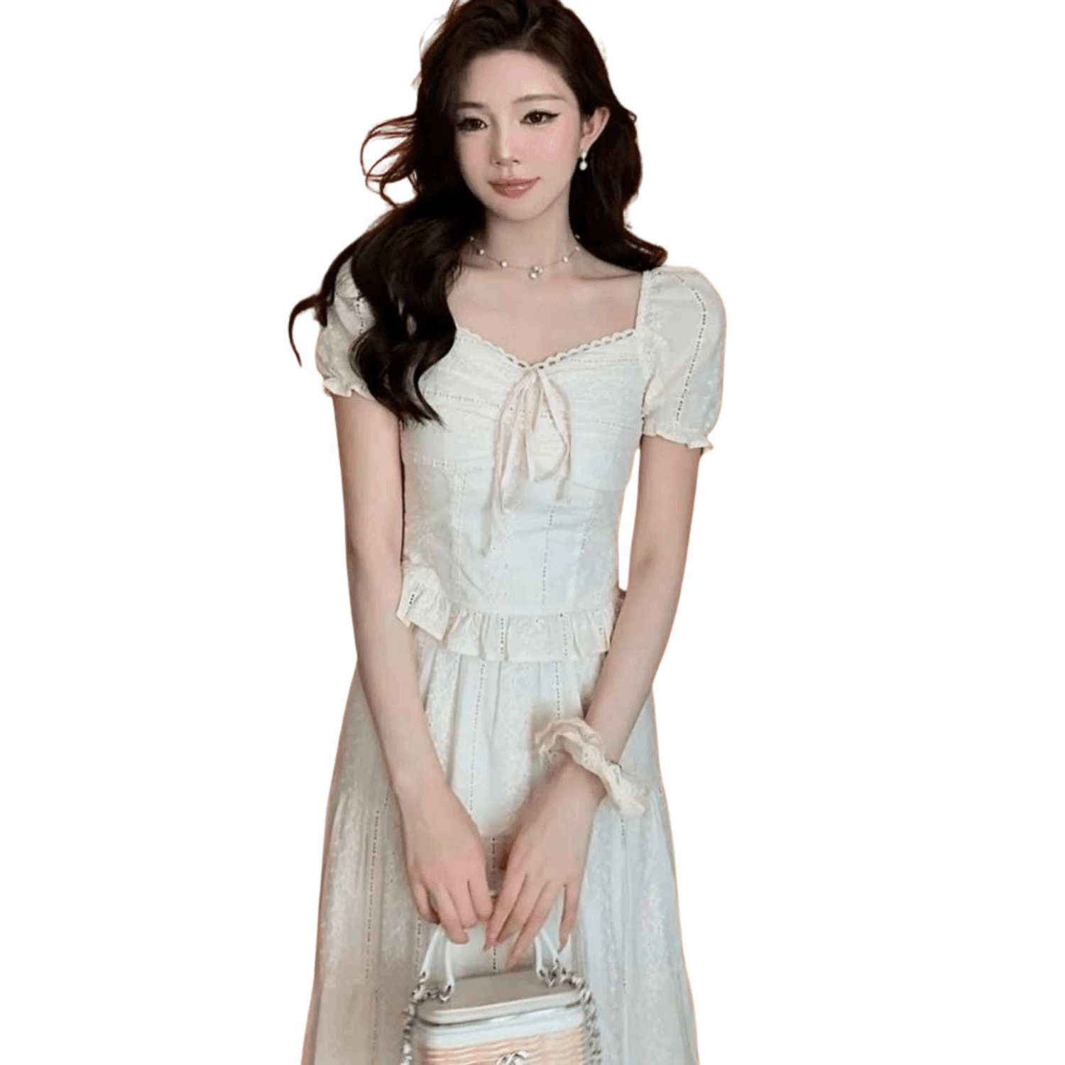 Woman wearing an elegant white lace short-sleeve midi dress holding a small handbag, minimalist fashion studio background