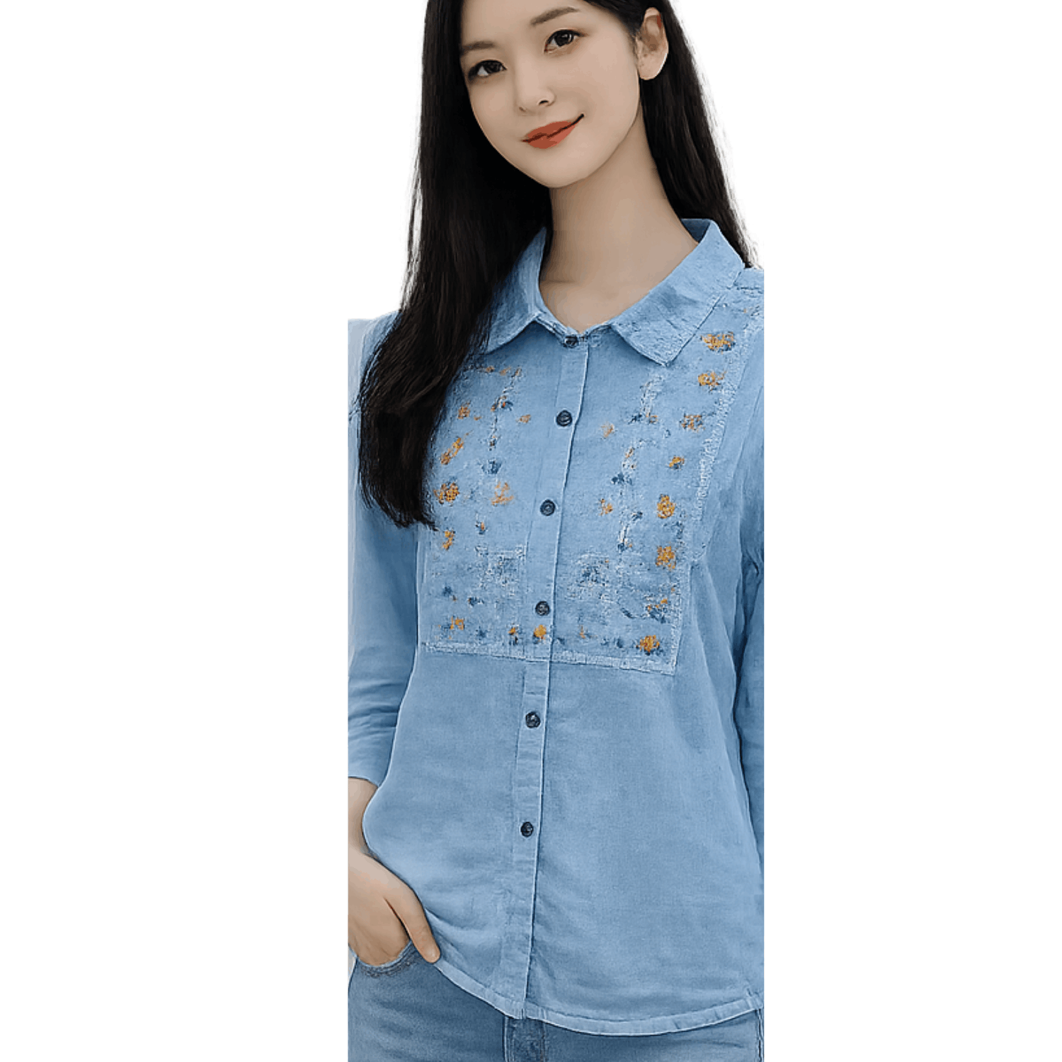 Woman wearing a light blue embroidered button up blouse with floral embroidery detail and long sleeves