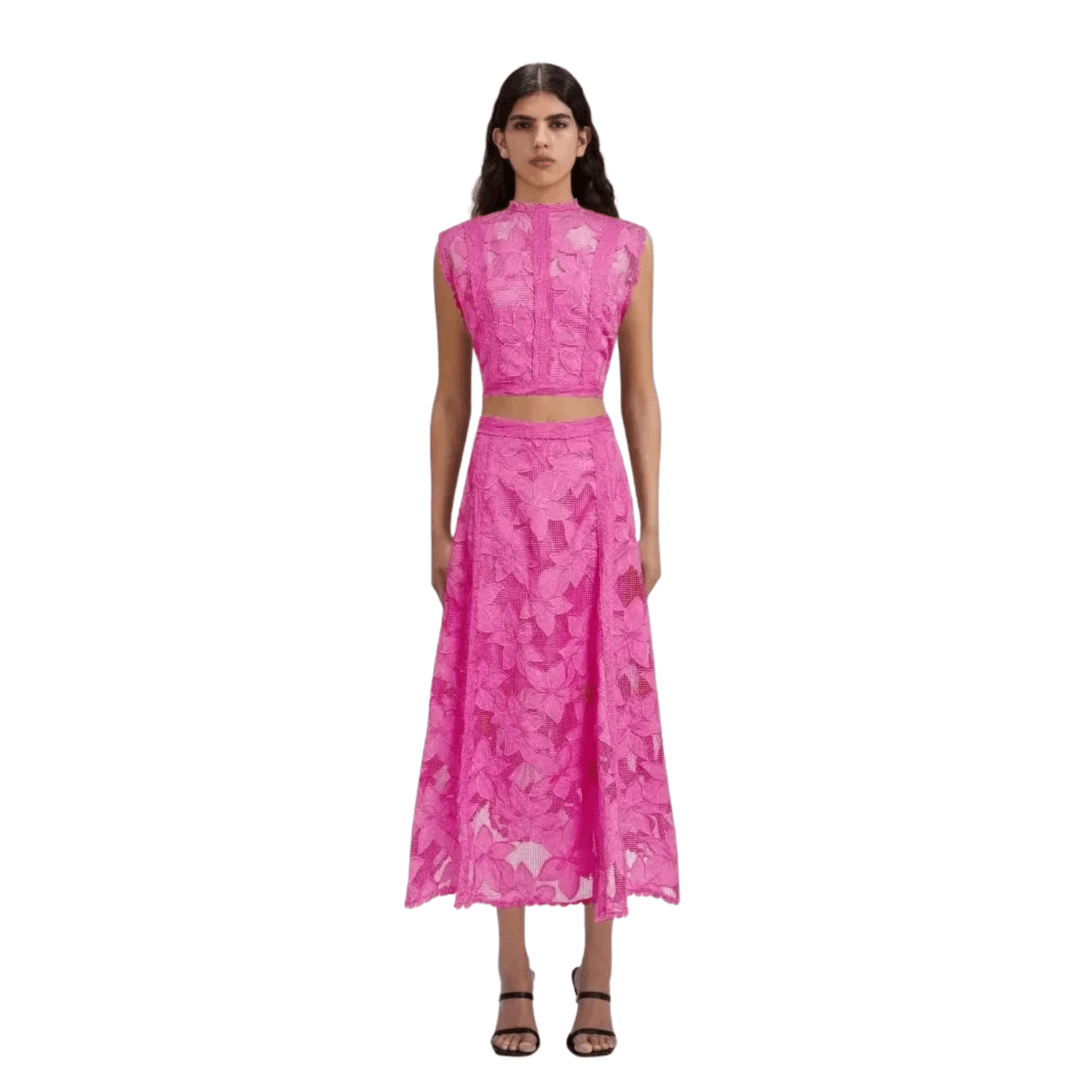 Woman wearing a pink floral lace two piece set with sleeveless crop top and midi skirt