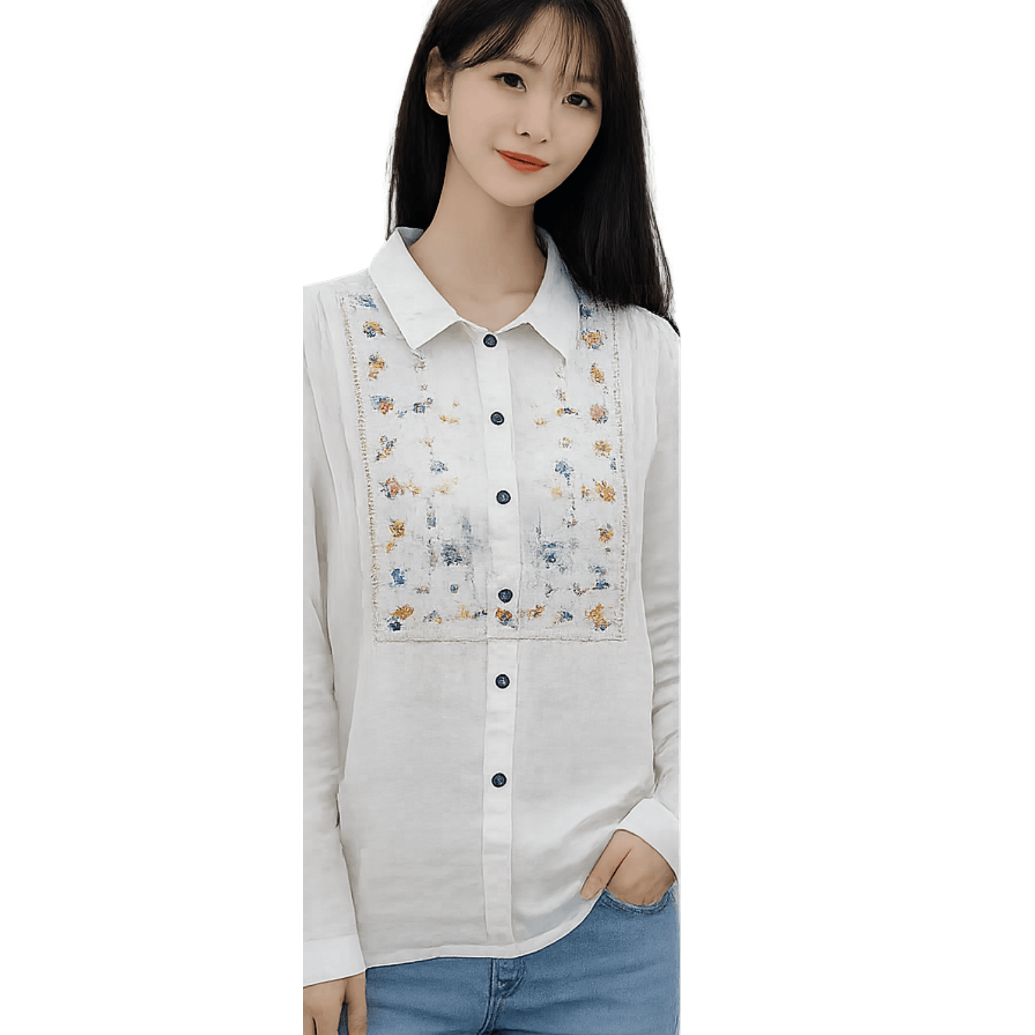 Woman wearing a white embroidered button up blouse with floral embroidery detail and long sleeves