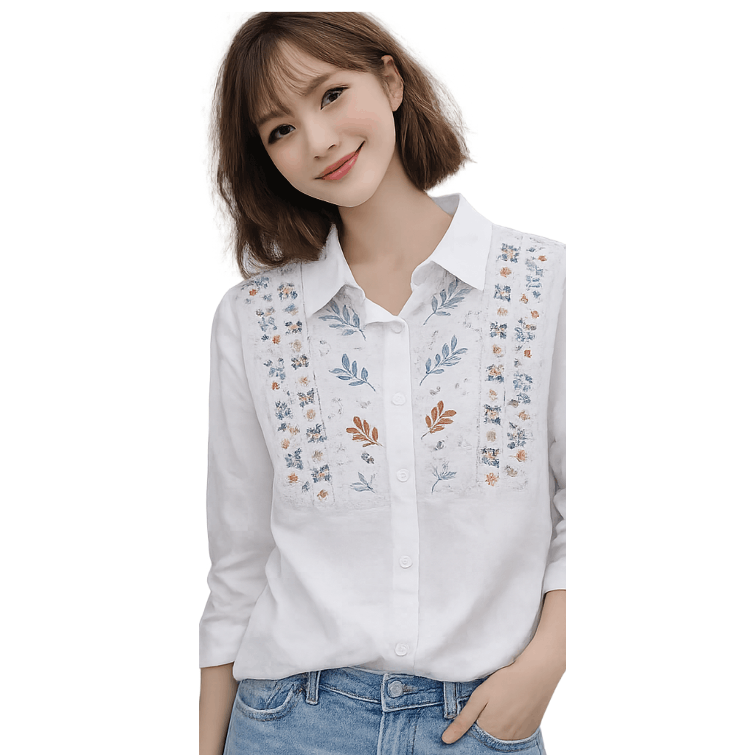 Woman wearing a white embroidered button up blouse with floral embroidery detail and long sleeves