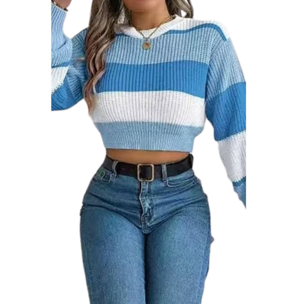Woman wearing a blue and white striped cropped knit sweater with long sleeves