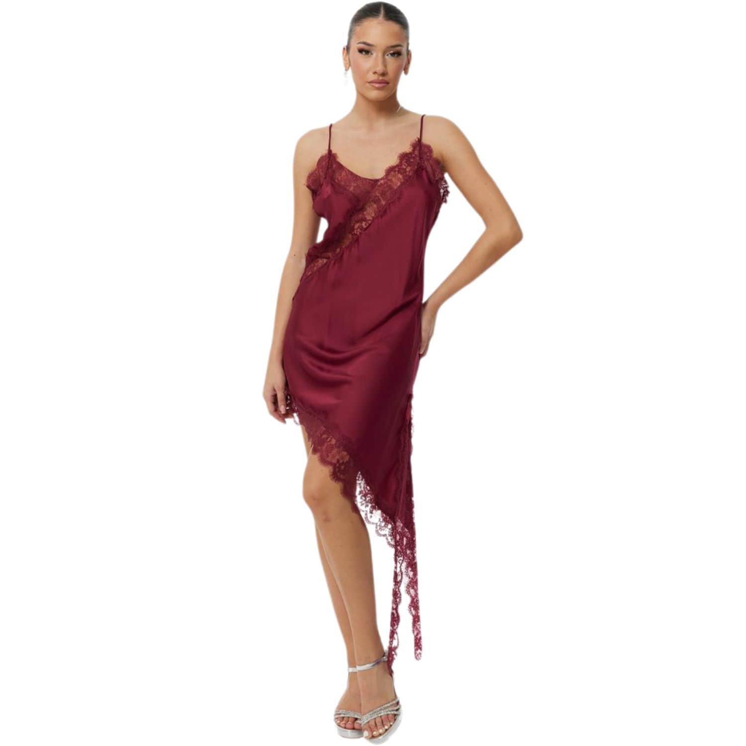 Women’s burgundy satin slip dress with asymmetrical lace trim and spaghetti straps, shown in studio lighting.