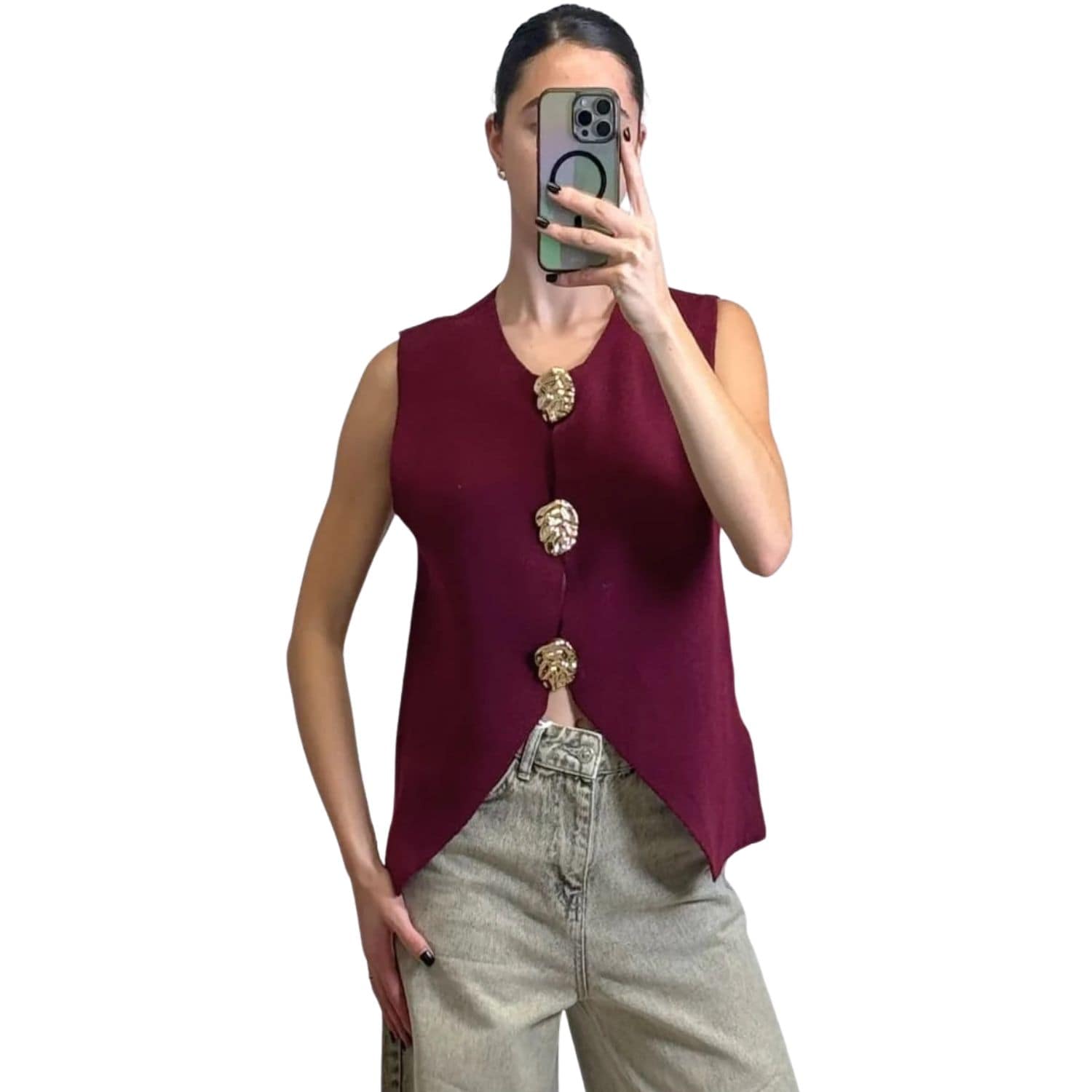 Women’s burgundy knit sleeveless vest with gold leaf-style buttons, styled with jeans.