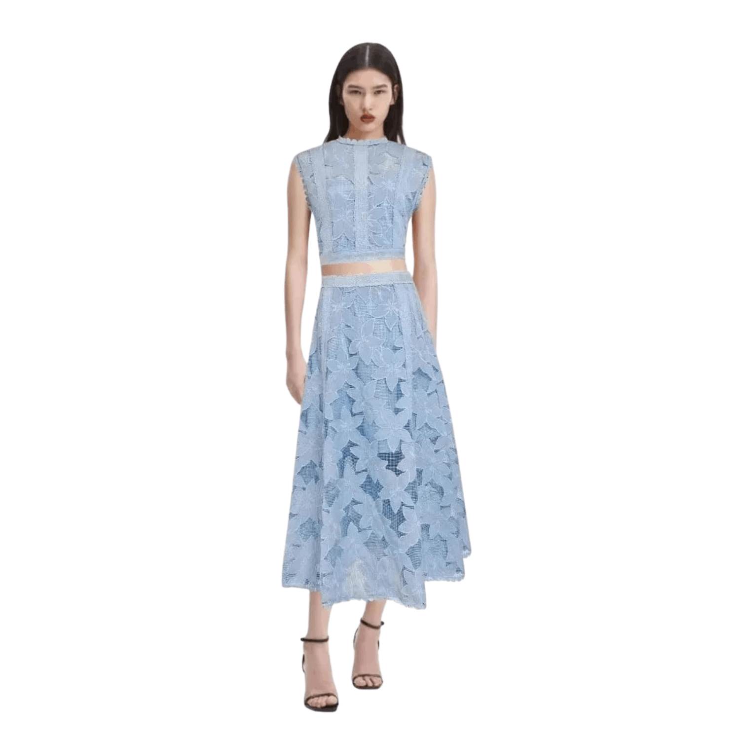 Woman wearing a blue floral lace two piece set with sleeveless crop top and midi skirt