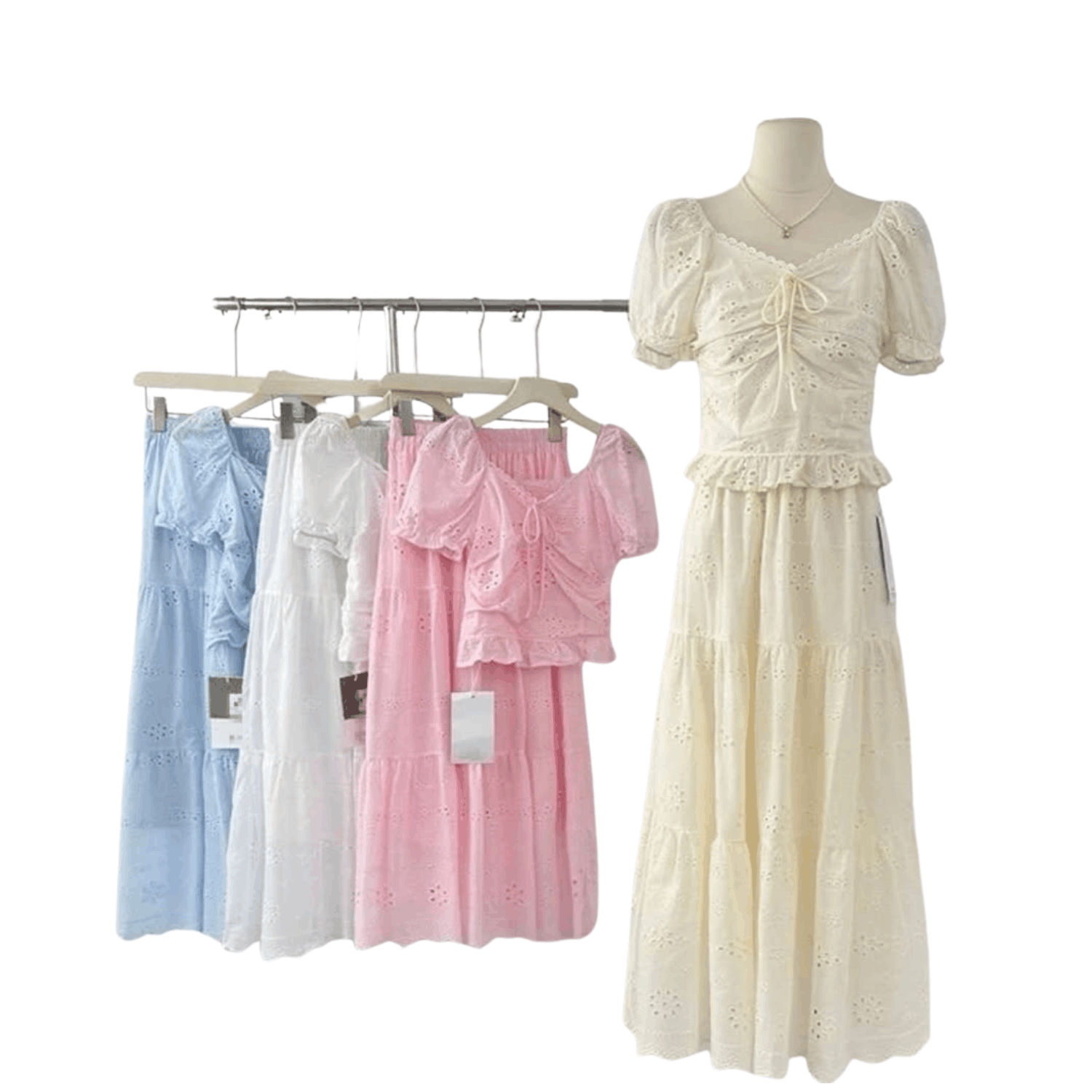 Women's eyelet lace short sleeve midi dress with tie front detail displayed on mannequin and clothing rack in blue, white, pink, and cream colors